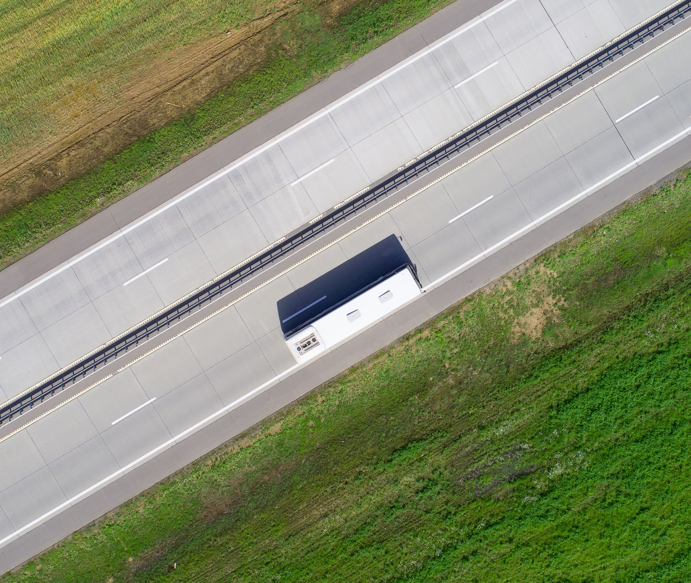 Bus on road drone above view. Theme of passenger transportation.